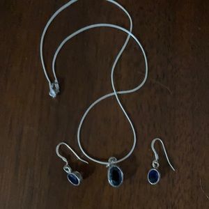 Deep purple stones in sterling silver. Pendant necklace and earrings.